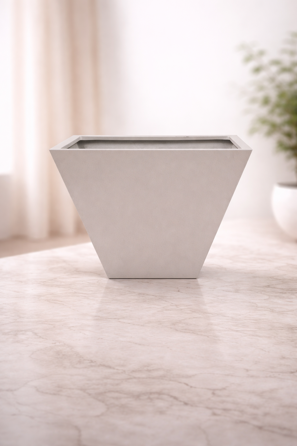 Minimalist fiber planter on marble floor